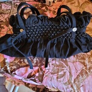 BCBGMaxazria Black Handbag with Ruffled Top Tie & Faux Silver Grommet